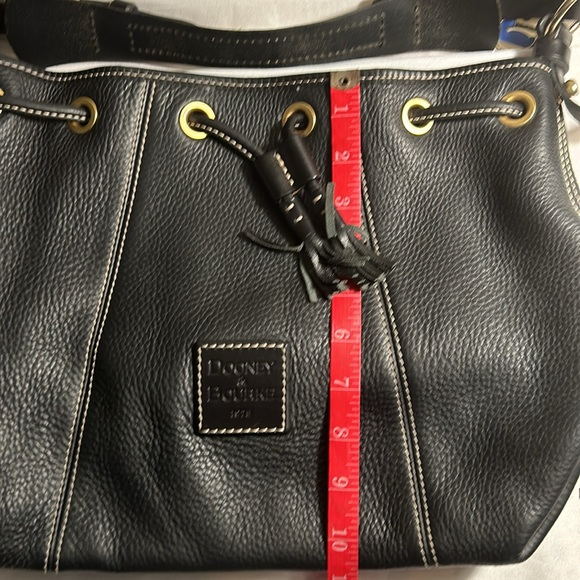 Dooney & Bourke Drawstring bag with tassels and duck tag. - Picture 4 of 12